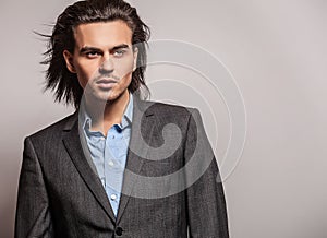 Elegant young handsome man. Studio fashion portrait.