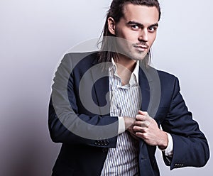 Elegant young handsome man. Studio fashion portrait.