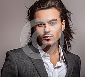 Elegant young handsome man. Studio fashion portrait.