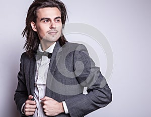 Elegant young handsome man. Studio fashion portrait.