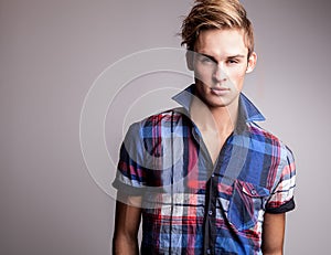 Elegant young handsome man. Studio fashion portrait.