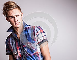 Elegant young handsome man. Studio fashion portrait.