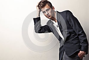 Elegant young handsome man. Studio fashion portrait on bright background.