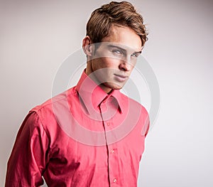 Elegant young handsome man. Studio fashion portrait on bright background.