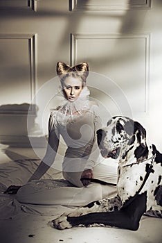 Elegant young lady relaxing with her friendly dog