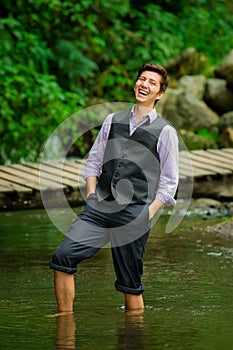 Elegant young man enjoying the nature with his