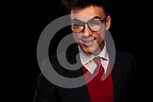 Elegant young man in suit wearing glasses