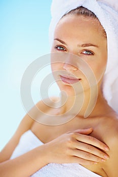 Elegant young spa woman in a towel after her bath. Portrait of a happy beautiful female in a towel after her bath.