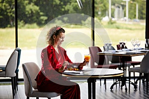 Elegant young woman eating shrimp salad for lunch in luxury restaurant, Healthy lifestyle and diet concept