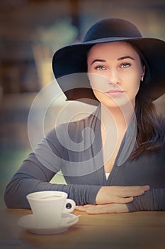 Elegant Young Woman Having Coffee