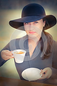 Elegant Young Woman Having Coffee