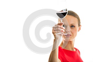 Elegant young woman having a glass of red wine