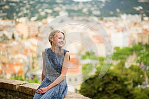 Elegant young woman in the Old town of Cannes