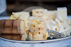 Elegantly cut cheeses on a platter for a wedding reception