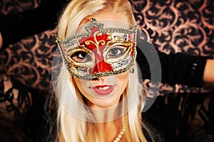 Elegantly dressed light hair model wearing a mask