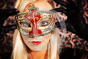 Elegantly dressed light hair model wearing a mask