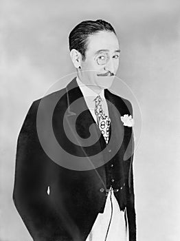 Elegantly dressed man with a monocle photo