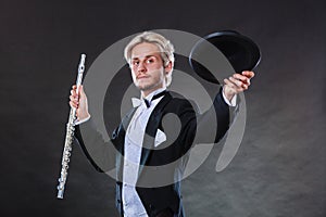 Elegantly dressed musician holding flute