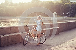 Elegantly dressed woman with bicycle