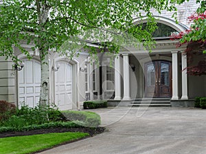 Elegantly landscaped house with circular driveway