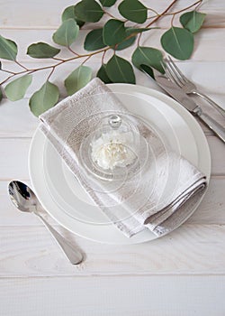 Elegantly served table with linen napkins and silverware