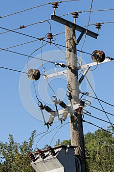 Elelctricity. Power distribution cable and junction on wooden te