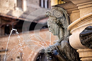 The element of monumental Fountain of Neptune in Bologna, Piazza Maggiore.