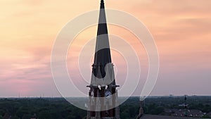 Element of old temple or catholic church. Naperville in evening time. Aerial zoom shot.