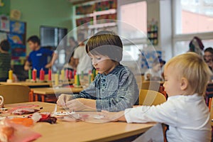 Elementary age child, creating art and craft product, dream catcher at school in art class