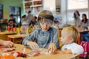 Elementary age child, creating art and craft product, dream catcher at school in art class