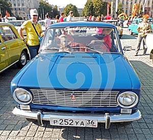 Elementary age children in the soviet retrocar VAZ-2101