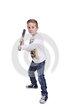 Elementary boy swinging baseball bat