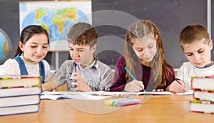 Elementary pupils in classroom during lesson