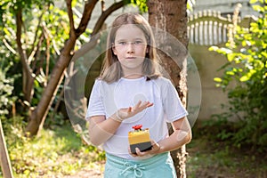 Elementary school age girl about to press a big red industrial emergency stop button, alarm, stopping action, urgency attention