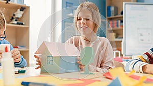 Elementary School Arts & Crafts Class: Cute Little Blond Girl Has Fun with Her Classmates on the H