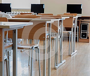 Elementary school classroom in Ukraine, school desks in the computer class