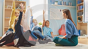Elementary School Creativity Class: Diverse Children Sitting on Carpet while Teacher Explains Less