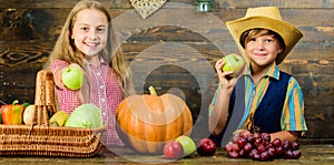 Elementary school fall festival idea. Celebrate harvest festival. Kids girl boy fresh vegetables harvest rustic style