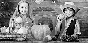 Elementary school fall festival idea. Celebrate harvest festival. Kids girl boy fresh vegetables harvest rustic style