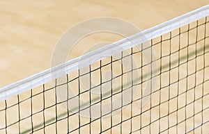 Elementary school gym indoor with volleyball net. Team sport concept