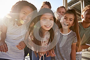 Elementary school kids smiling to camera at break time