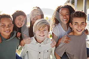 Elementary school kids smiling to camera during school break