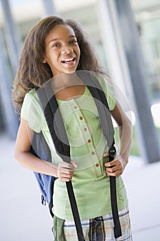 Elementary school pupil outside building