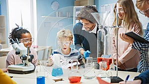 Elementary School Science Classroom: Enthusiastic Teacher Explains Chemistry to Diverse Group of