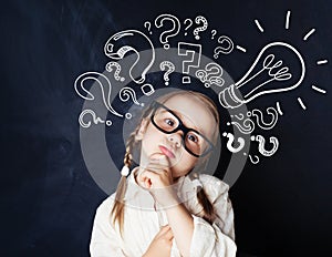 Elementary school student girl with question marks
