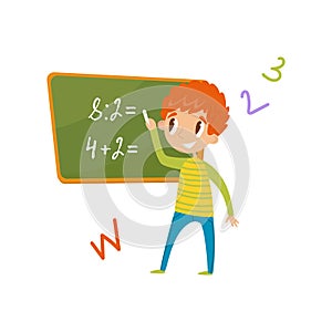 Elementary school student standing near the blackboard and writing mathematical examples, education and knowledge