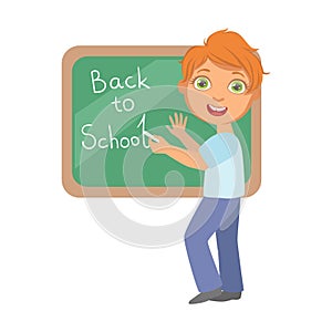 Elementary school student writing text Back to School on the blackboard, a colorful character isolated on a white