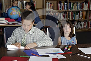 Elementary school students studying