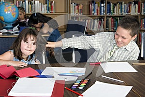 Elementary student gets her hair pulled in library