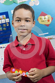 Elementary Student With Harmonica